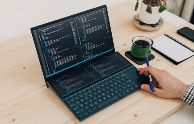 a person using a laptop to code 